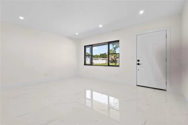 a view of an empty room with a window