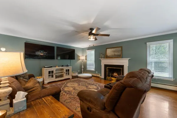 a kitchen with stainless steel appliances kitchen island granite countertop a stove a sink and a microwave