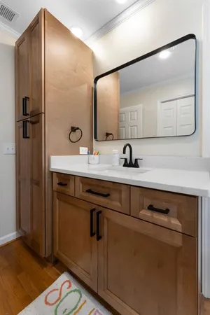 a kitchen with a sink a stove and cabinets