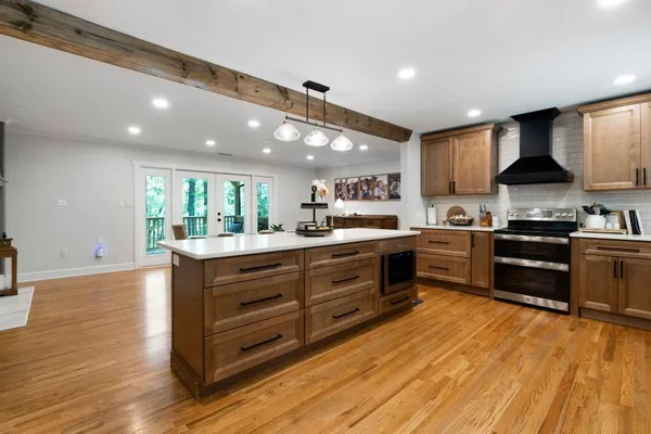 a living room with furniture a air conditioner and a window