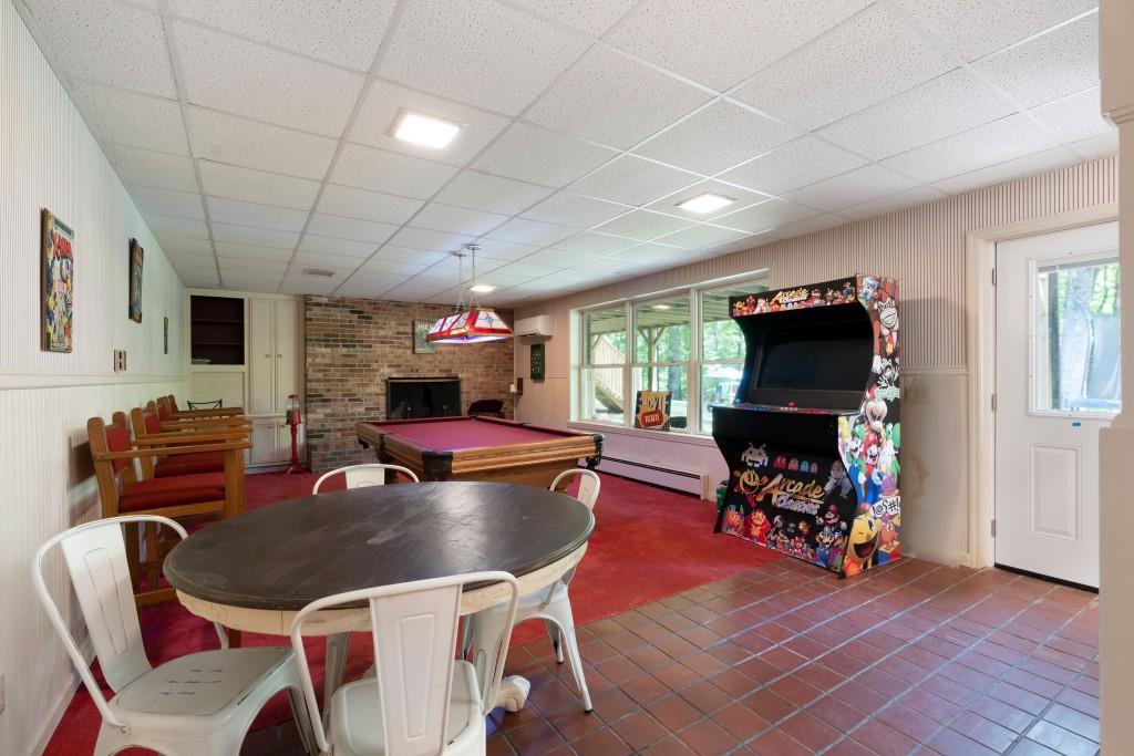 311 Herring Road Armuchee, GA 30105 - Photo 49 of 66 a living room with furniture a flat screen tv and a floor to ceiling window