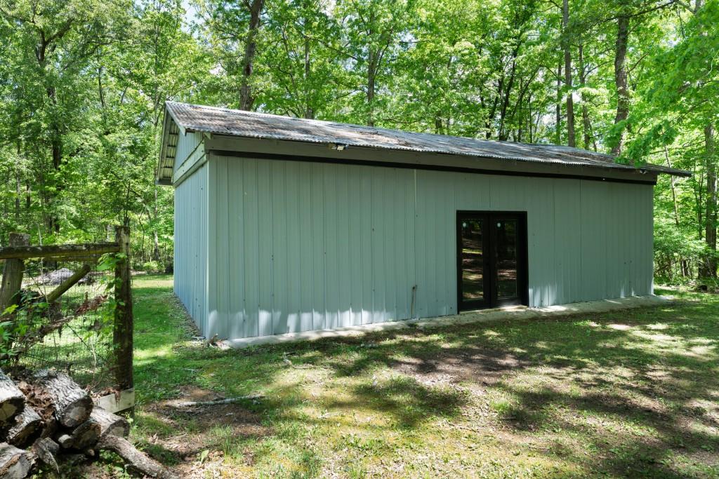 311 Herring Road Armuchee, GA 30105 - Photo 57 of 66 a backyard of a house with lots of green space