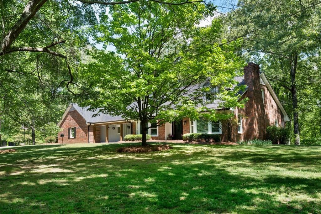 311 Herring Road Armuchee, GA 30105 - Photo 66 of 66 a front view of house with a garden