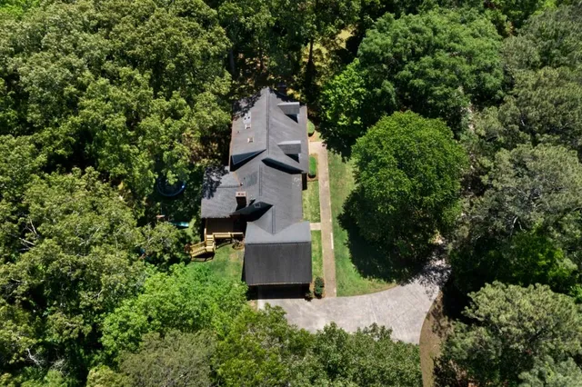a bathroom with a double vanity sink a mirror and a shower
