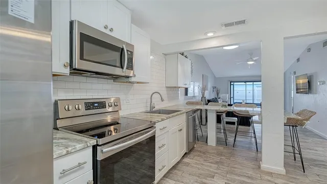 a bathroom with a toilet sink shower and mirror