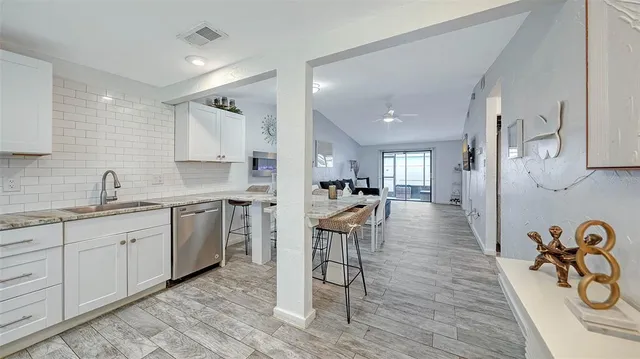 a bathroom with bathtub and shower