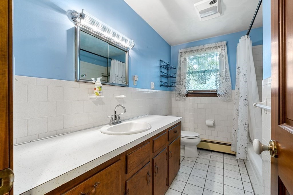 25 Pine Ridge Drive Ayer, MA 01432 - Photo 20 of 30 a bathroom with a sink a toilet and a mirror