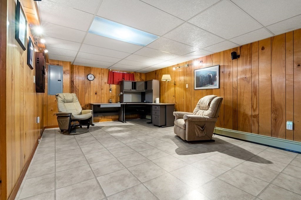 25 Pine Ridge Drive Ayer, MA 01432 - Photo 23 of 30 a living room with furniture and a flat screen tv
