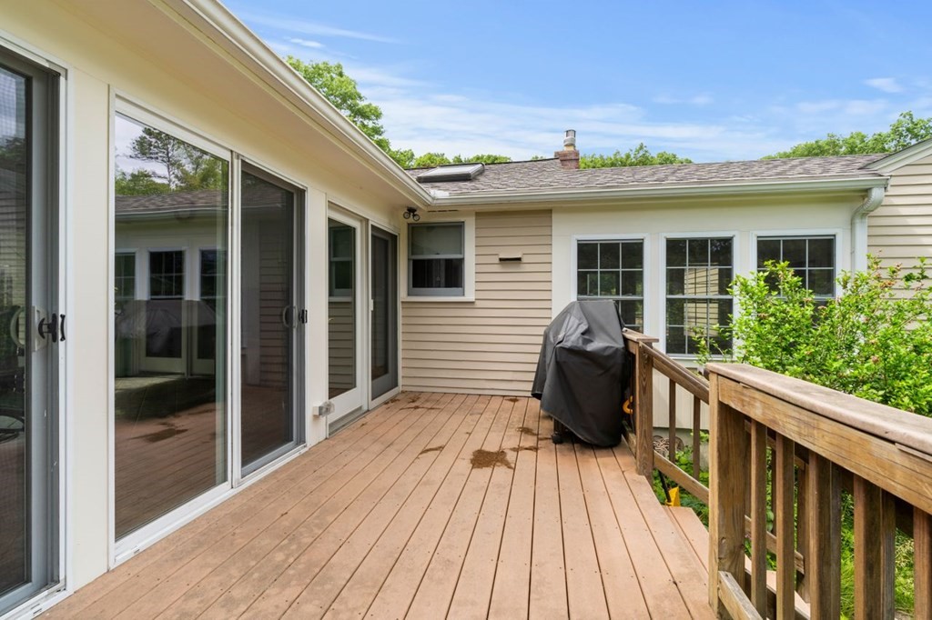 25 Pine Ridge Drive Ayer, MA 01432 - Photo 28 of 30 a view of a deck with wooden floor and outer view