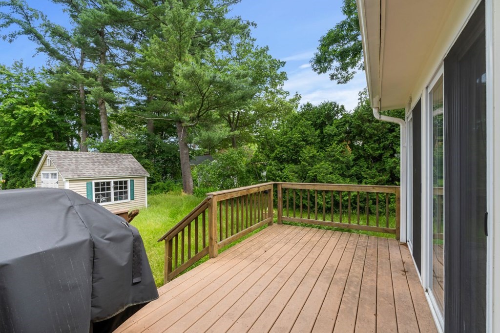 25 Pine Ridge Drive Ayer, MA 01432 - Photo 29 of 30 a balcony with wooden floor and outdoor seating