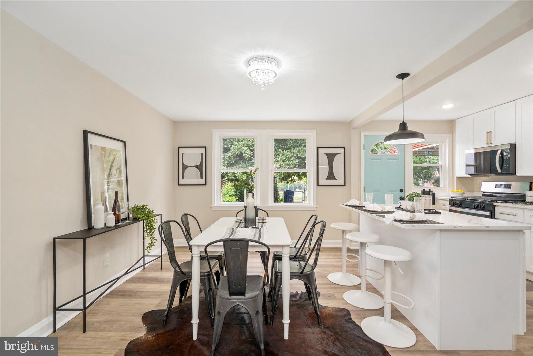 3531 Elmora Avenue Baltimore, MD 21213 - Photo 12 of 38 a view of a dining room with furniture window and outside view