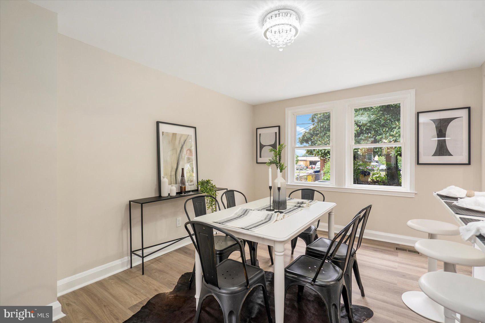 3531 Elmora Avenue Baltimore, MD 21213 - Photo 13 of 38 a view of a dining room with furniture and window