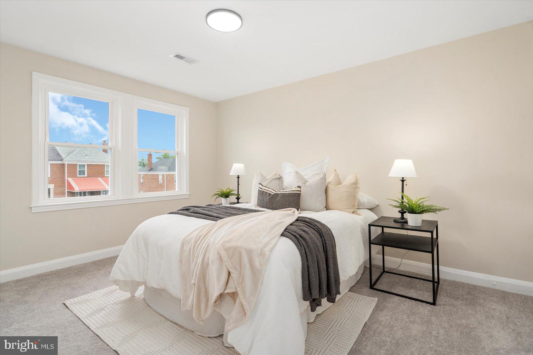 3531 Elmora Avenue Baltimore, MD 21213 - Photo 22 of 38 a bedroom with a bed and window