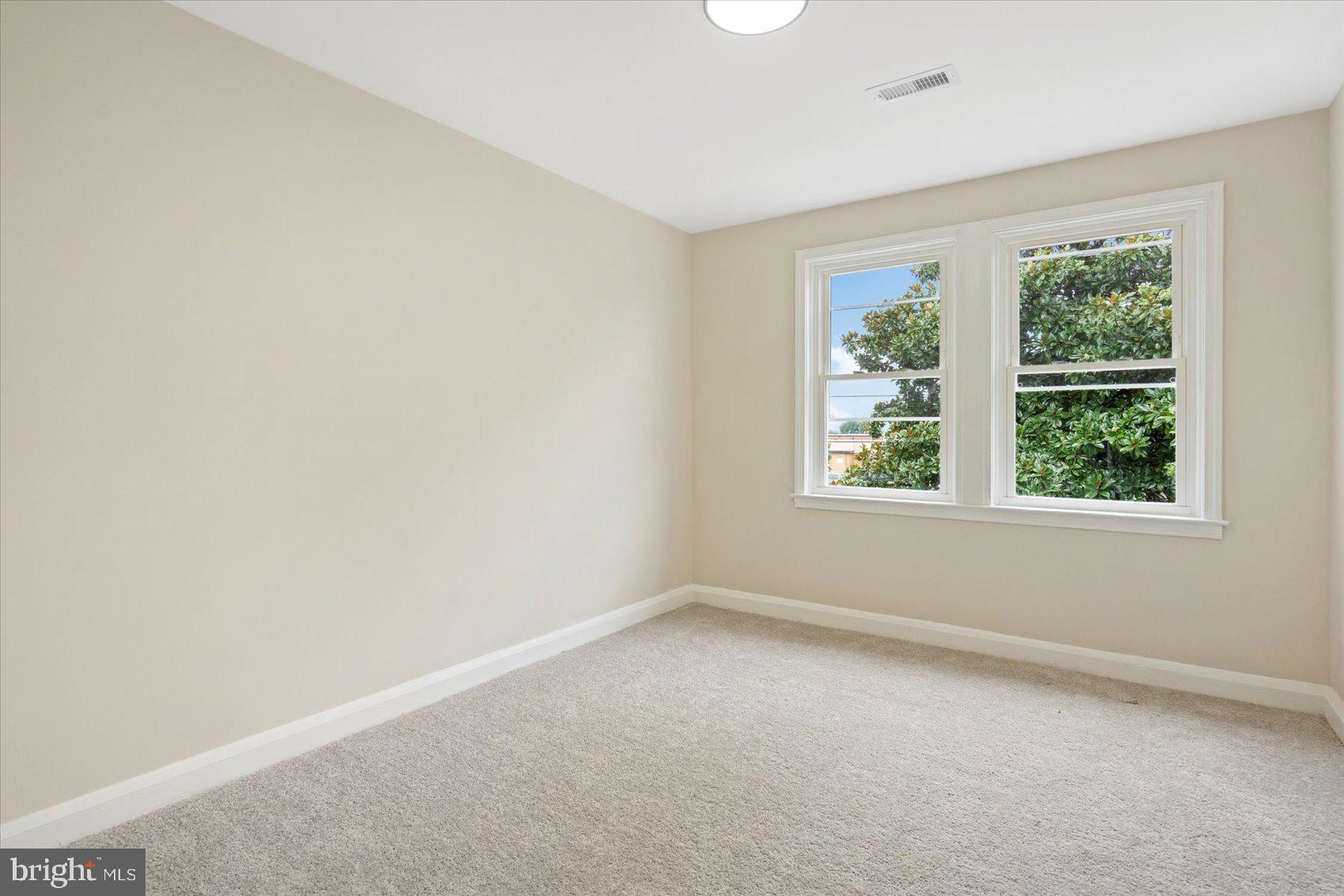 3531 Elmora Avenue Baltimore, MD 21213 - Photo 27 of 38 an empty room with windows