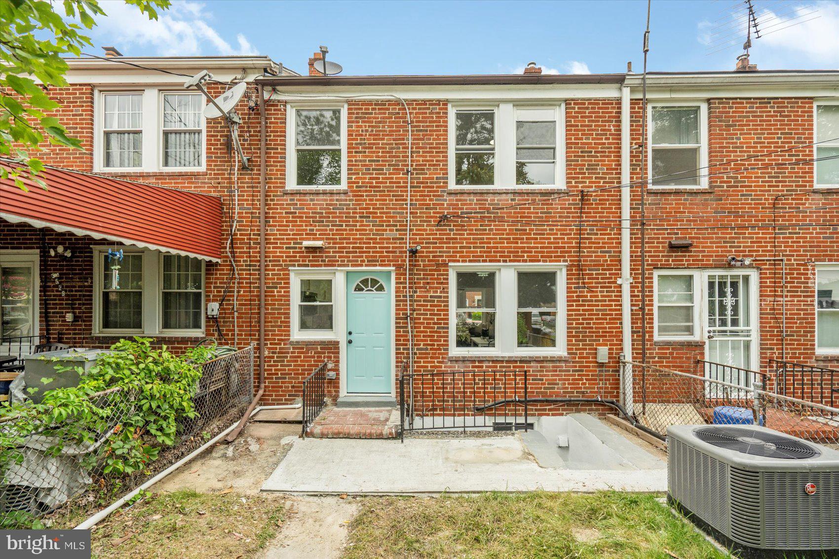 3531 Elmora Avenue Baltimore, MD 21213 - Photo 38 of 38 a front view of a house with a yard
