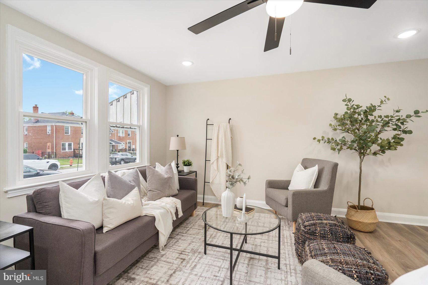 3531 Elmora Avenue Baltimore, MD 21213 - Photo 7 of 38 a living room with furniture and a large window