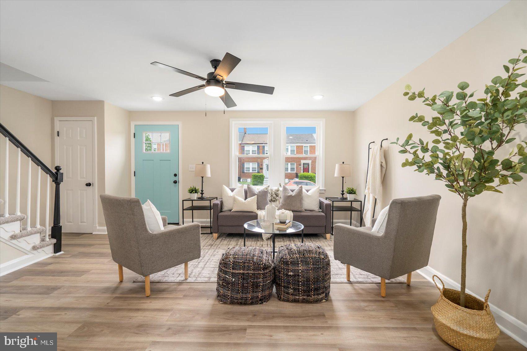 3531 Elmora Avenue Baltimore, MD 21213 - Photo 8 of 38 a living room with furniture and a potted plant