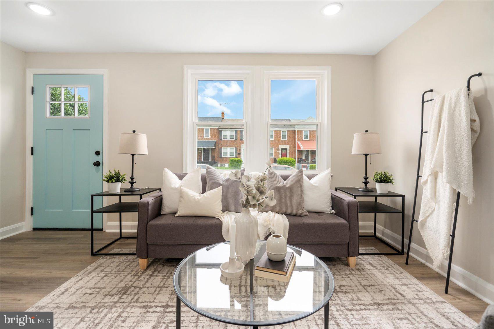 3531 Elmora Avenue Baltimore, MD 21213 - Photo 9 of 38 a living room with furniture and a large window