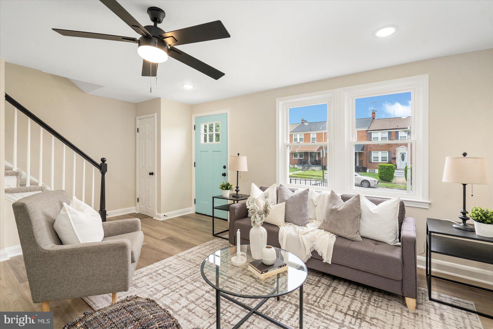 3531 Elmora Avenue Baltimore, MD 21213 - Photo 10 of 38 a living room with furniture and a large window