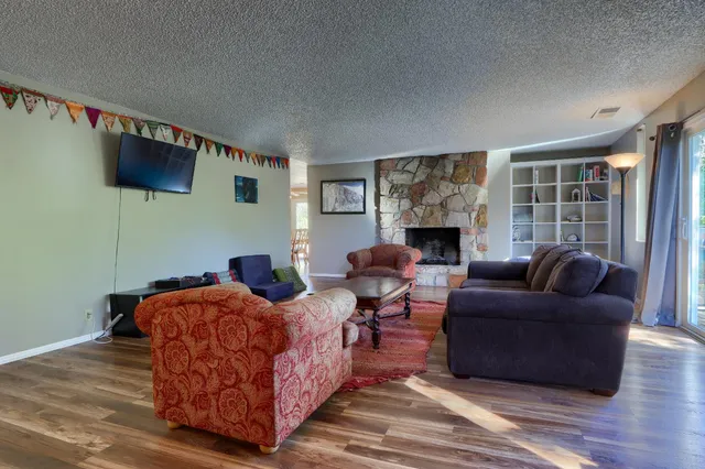 a bedroom with a bed and a fireplace