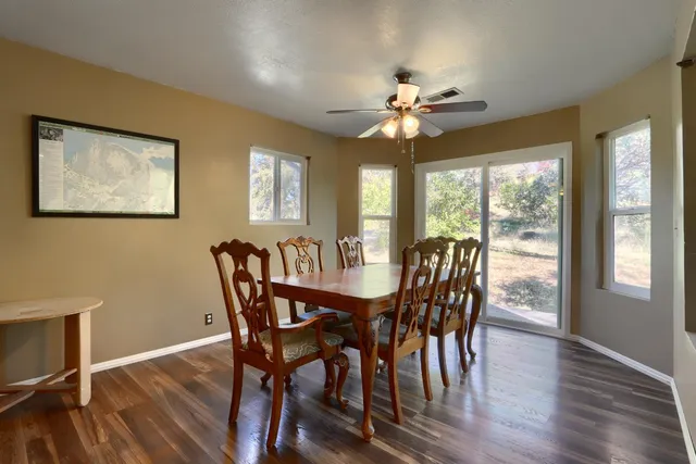 a kitchen with stainless steel appliances granite countertop a sink and a refrigerator