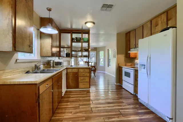 a kitchen with a sink and cabinets