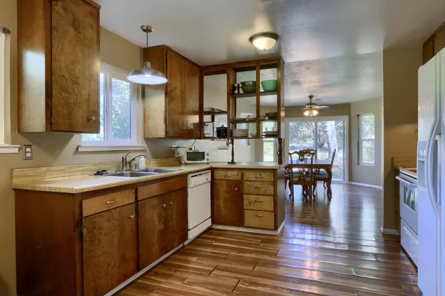 a kitchen with a stove and a refrigerator
