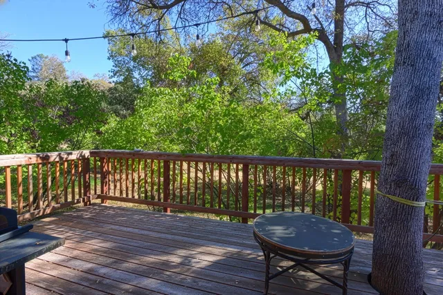 a view of a wooden bench on the deck