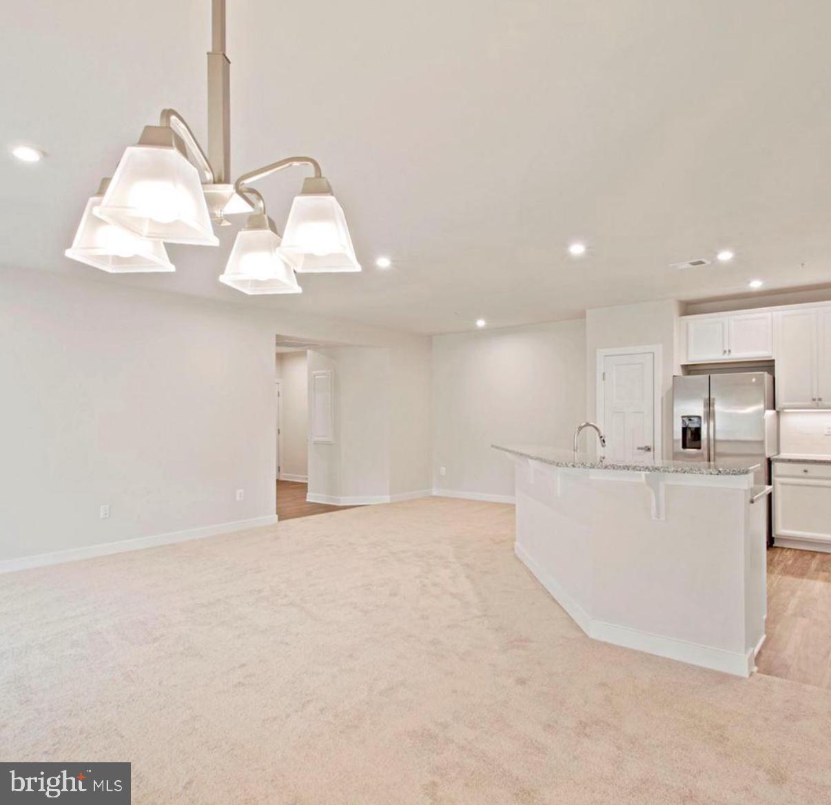 10010 Ruffian Way, Unit R Laurel, MD 20723 - Photo 15 of 32 Bright and airy open living space.