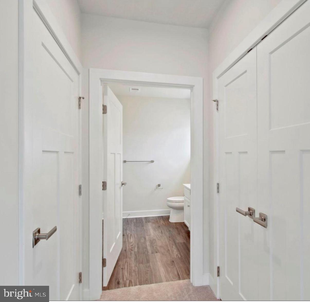10010 Ruffian Way, Unit R Laurel, MD 20723 - Photo 28 of 32 Modern hallway with sleek doors.