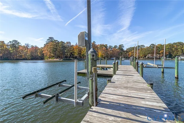 a view of a terrace with wooden floor and lake view