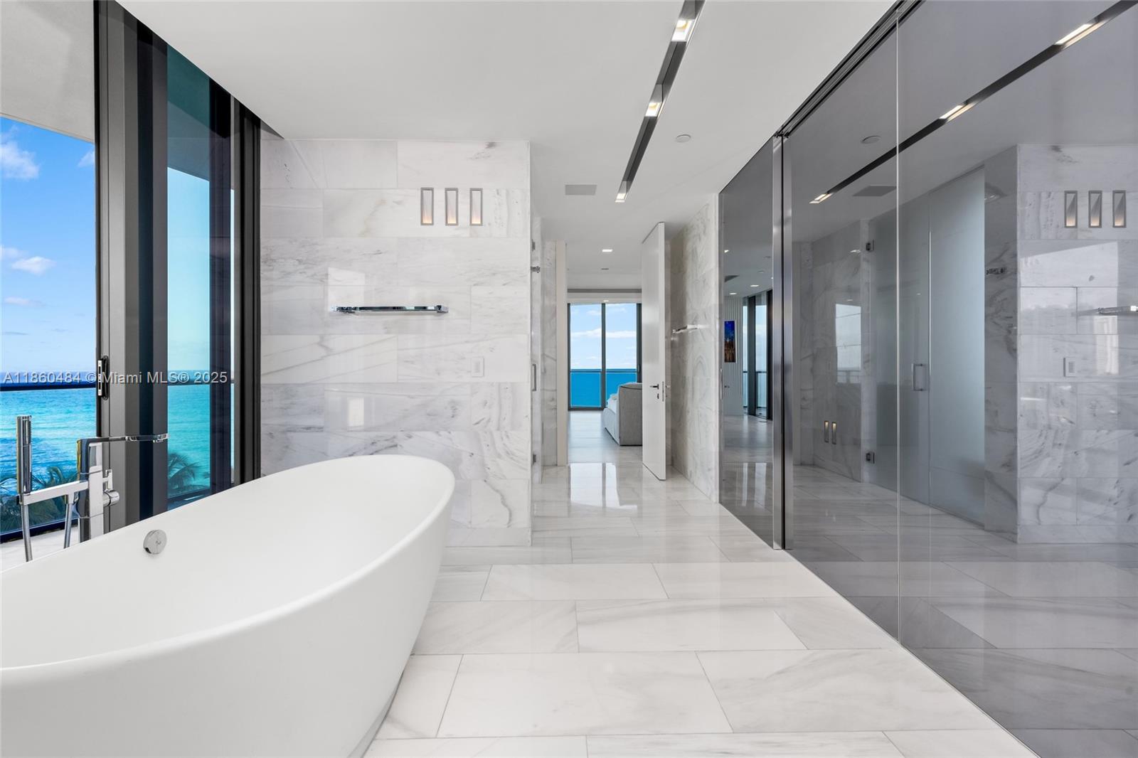 19575 Collins Avenue, Unit 6 Sunny Isles Beach, FL 33160 - Photo 21 of 42 a bathroom with a bathtub and a shower