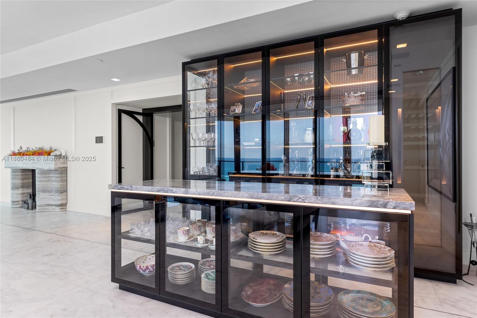19575 Collins Avenue, Unit 6 Sunny Isles Beach, FL 33160 - Photo 7 of 42 a room with stainless steel appliances a sink and a large window