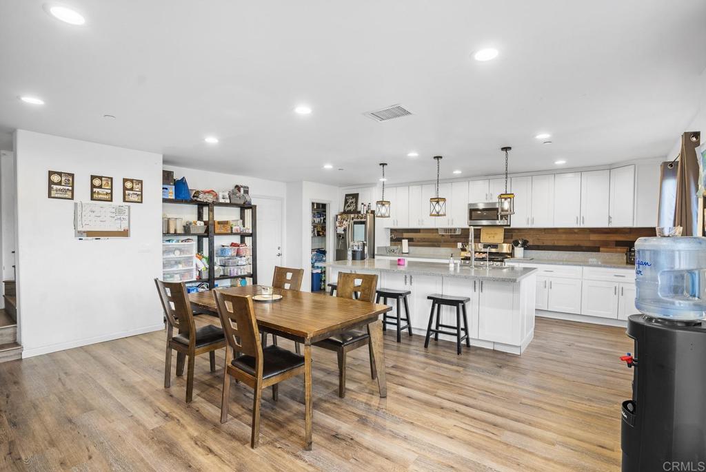 20591 Sycamore Springs Road Jamul, CA 91935 - Photo 12 of 53 a view of kitchen with cabinets table and chairs