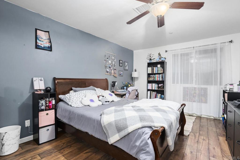 20591 Sycamore Springs Road Jamul, CA 91935 - Photo 19 of 53 a bedroom with a bed and a book shelf