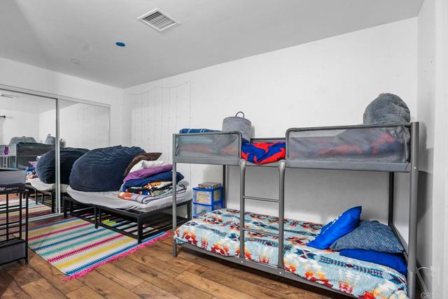 a living room with lots of furniture and clutter