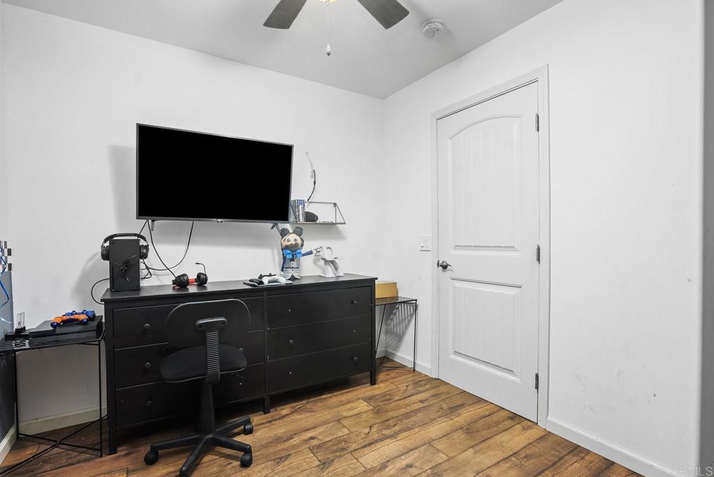 20591 Sycamore Springs Road Jamul, CA 91935 - Photo 23 of 53 a bedroom with a workspace