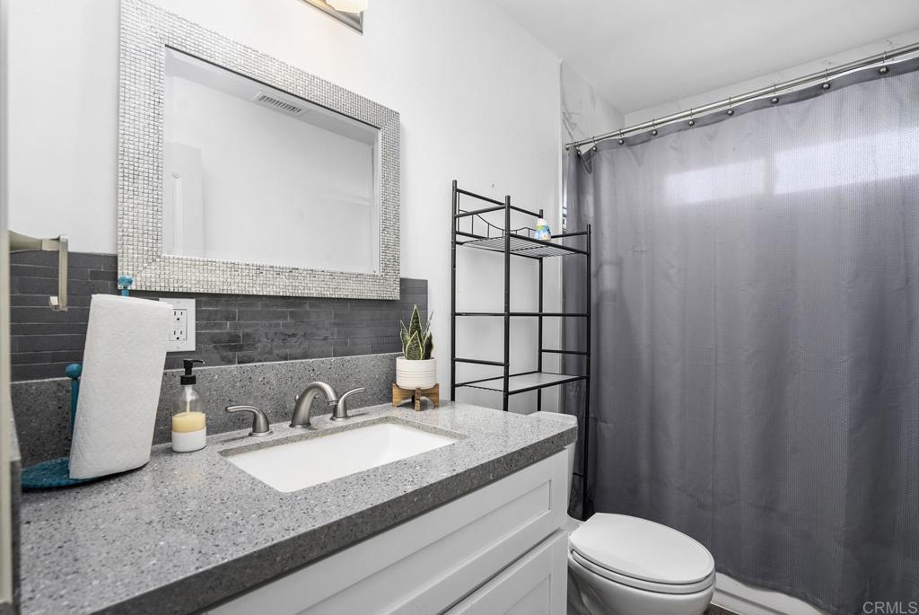 20591 Sycamore Springs Road Jamul, CA 91935 - Photo 24 of 53 a bathroom with a sink a toilet and shower