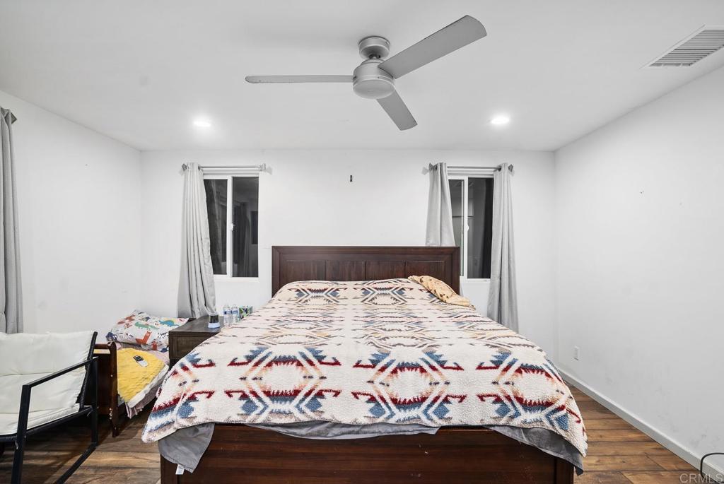 20591 Sycamore Springs Road Jamul, CA 91935 - Photo 28 of 53 a bedroom with a bed and a dresser