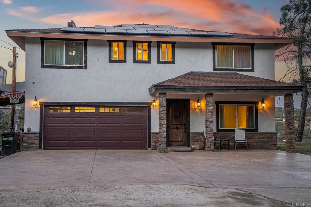 20591 Sycamore Springs Road Jamul, CA 91935 - Photo 34 of 53 a front view of a house with a yard and garage