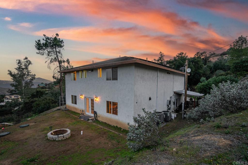 20591 Sycamore Springs Road Jamul, CA 91935 - Photo 36 of 53 a backyard of a house with plants and lake view