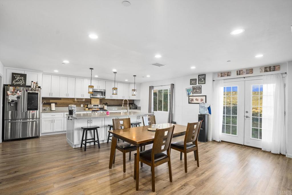 20591 Sycamore Springs Road Jamul, CA 91935 - Photo 4 of 53 a view of a dining room with furniture and wooden floor