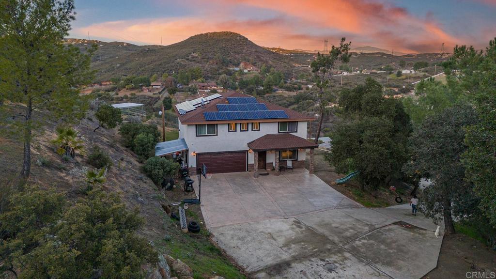 20591 Sycamore Springs Road Jamul, CA 91935 - Photo 44 of 53 a view of a house with a mountain in the background