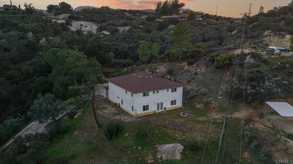 20591 Sycamore Springs Road Jamul, CA 91935 - Photo 48 of 53 a view of a house with a yard and covered with green space