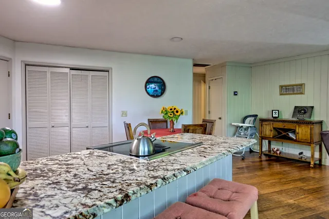 a kitchen with a table chairs and a dining table