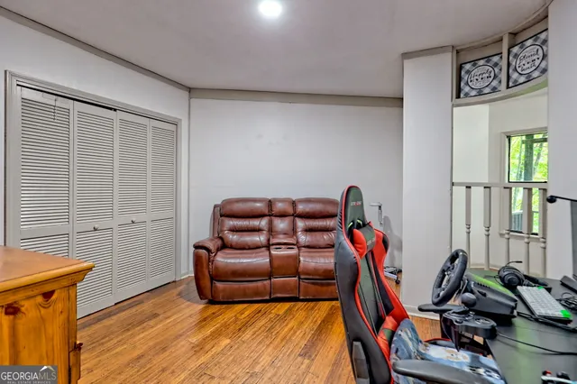 a bed sitting in a bedroom next to a window