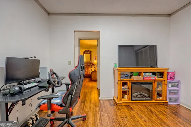 a bed sitting in a bedroom next to a window