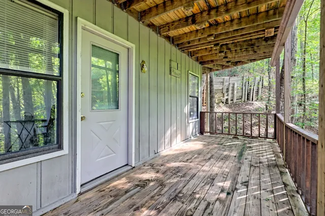 a balcony with trees in front of it