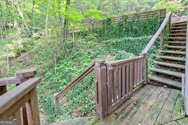 a view of balcony with wooden floor