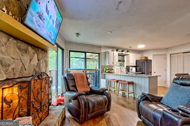 a dining room with furniture and wooden floor